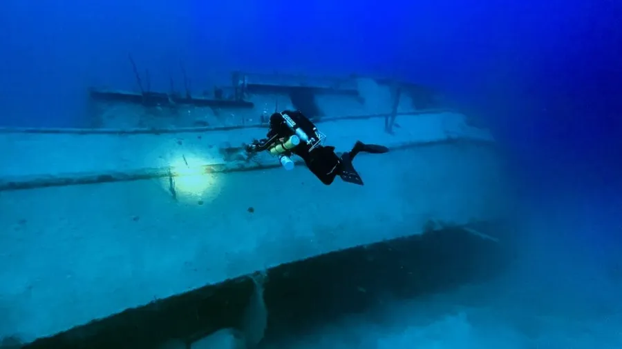 A rebreather diver over the Josie J wreck off Roatán